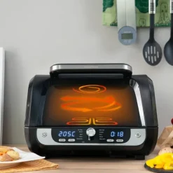 Varmluftsfrituregryde med grill, tilbehør og opskriftsbog InnovaGoods Fryinn 12-in-1 6000 Sort Stål 3400 W 6 L