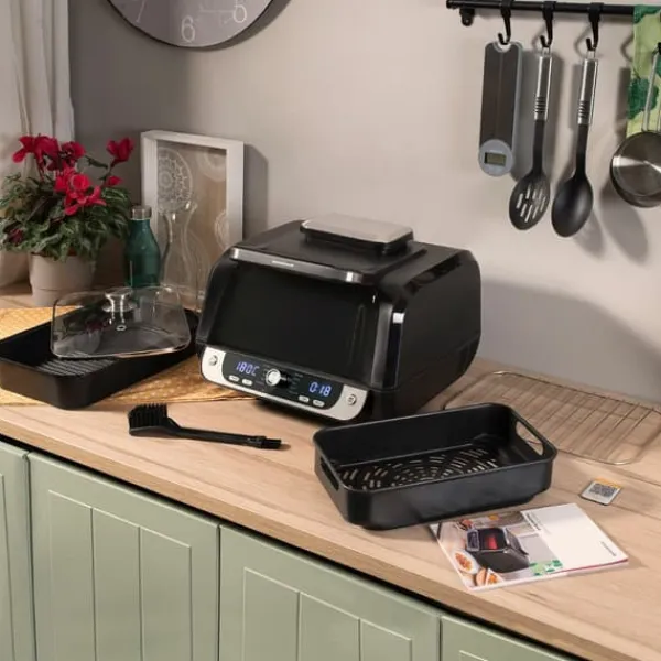 Grill-Ovne & Ovn Med Roterende Stegespyd>Varmluftsfrituregryde med grill, tilbehør og opskriftsbog InnovaGoods Fryinn 12-in-1 6000 Sort Stål 3400 W 6 L