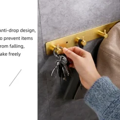 Vægmonteret knagerække i guld med 5 kroge - installation uden boring Clearance